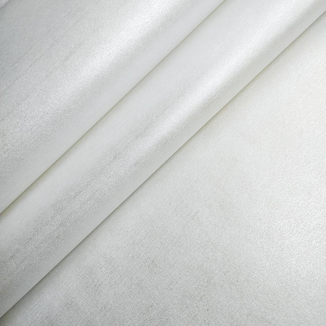Pearl-colored Kozo Studio mulberry paper with a smooth metallic sheen, perfect for gift wrapping, design, or sculpture, shown partially unrolled.