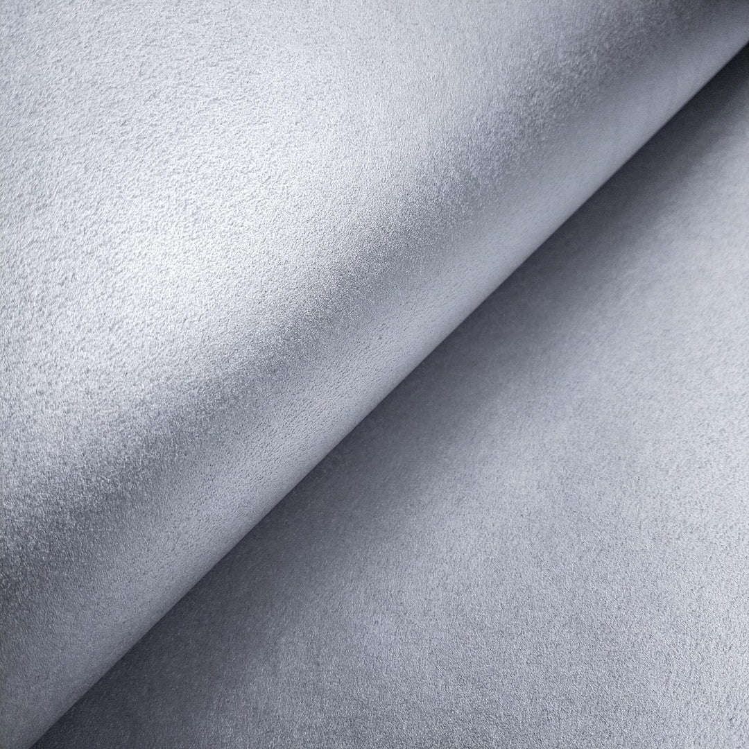 Kozo Studio's Gleaming Metallic Kozo handmade paper in silver, captured in a detailed close-up to showcase the textured mulberry paper surface.