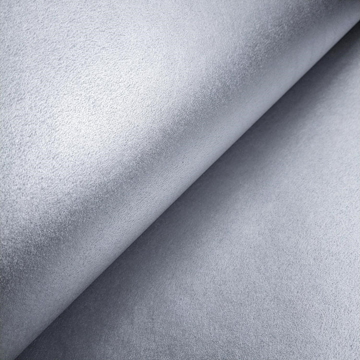 Kozo Studio's Gleaming Metallic Kozo handmade paper in silver, captured in a detailed close-up to showcase the textured mulberry paper surface.