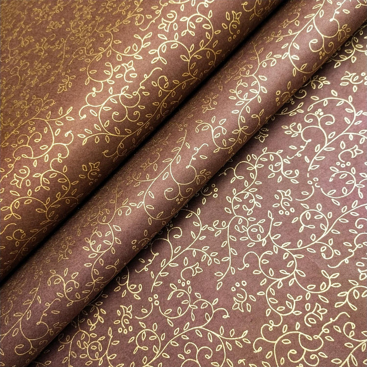Handcrafted Kozo Studio mulberry paper in brown with a shimmering gold floral pattern, showcasing the beauty of premium handmade paper.