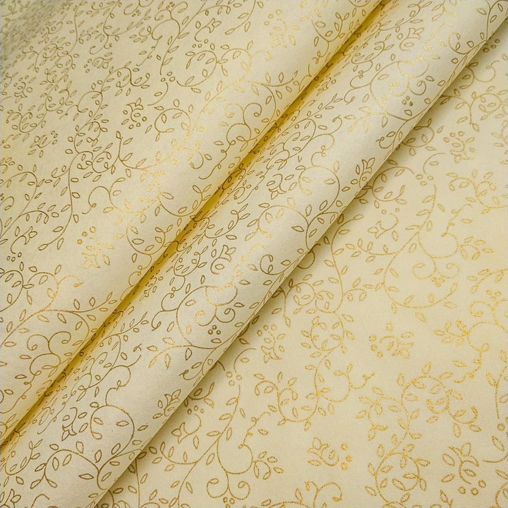 Kozo Studio's Grapevine print handmade paper roll with gold floral accents on smooth ivory mulberry paper, artistically unfurled.