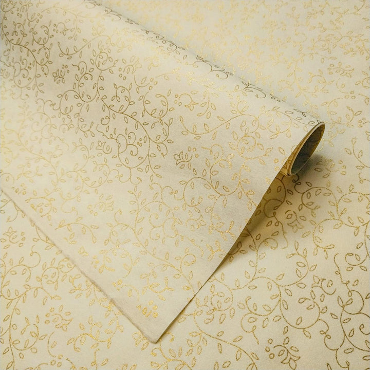 Unrolled Grapevine Screen-printed handmade paper from Kozo Studio featuring gold floral patterns on ivory mulberry paper with intricate vines and leaves.