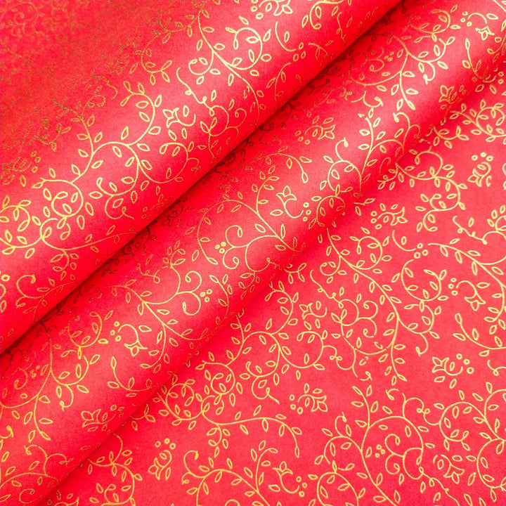 Luxurious Kozo Studio red handmade mulberry paper with gold floral screen printing, featuring swirling vines and leaves that enhance any artistic surface.