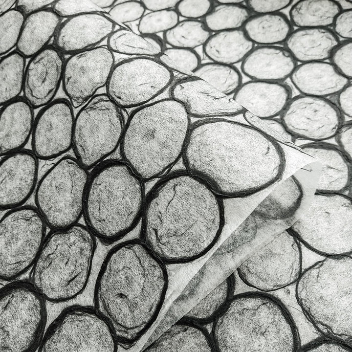 A textured sheet of mulberry paper from Kozo Studio, with a hand-drawn circle mosaic resembling a beehive, used for lampshades, decor, and mixed media art.