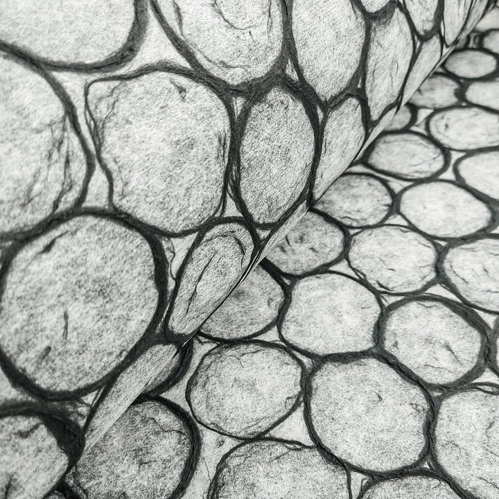 Decorative handmade paper by Kozo Studio featuring an abstract beehive design made of black-edged circles on translucent mulberry paper, great for art and design projects.