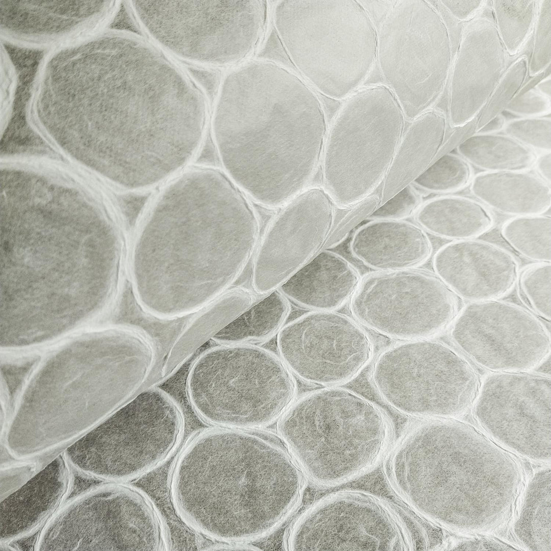 Kozo Studio beehive-style handmade paper with a white translucent base and subtle circular textures, embodying the elegance of high-quality mulberry paper.