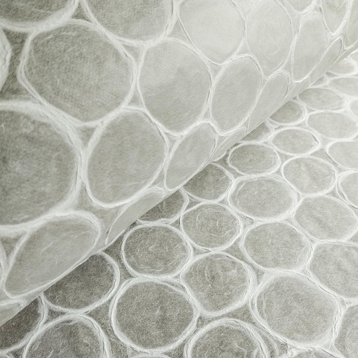 Kozo Studio beehive-style handmade paper with a white translucent base and subtle circular textures, embodying the elegance of high-quality mulberry paper.