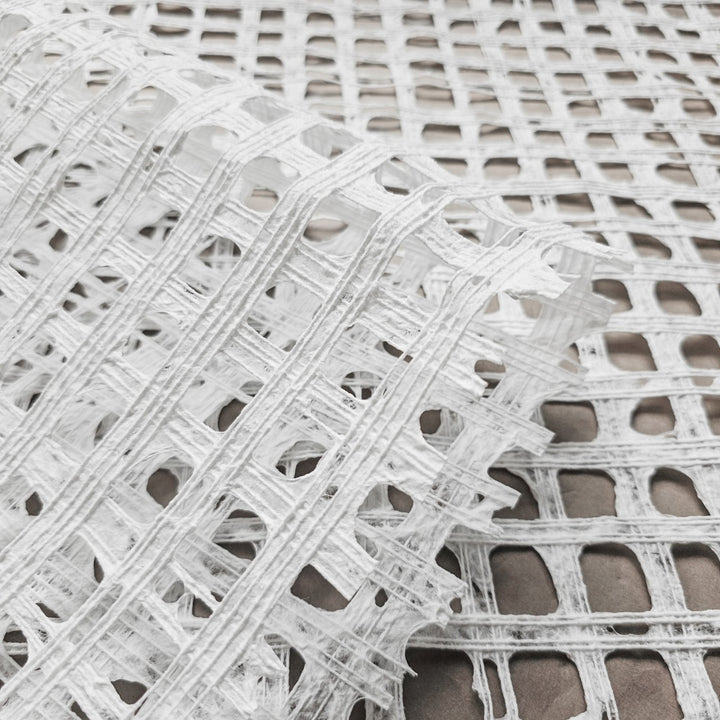 Elegant handmade mulberry paper sheet from Kozo Studio, highlighting a unique glen plaid texture formed through traditional craftsmanship