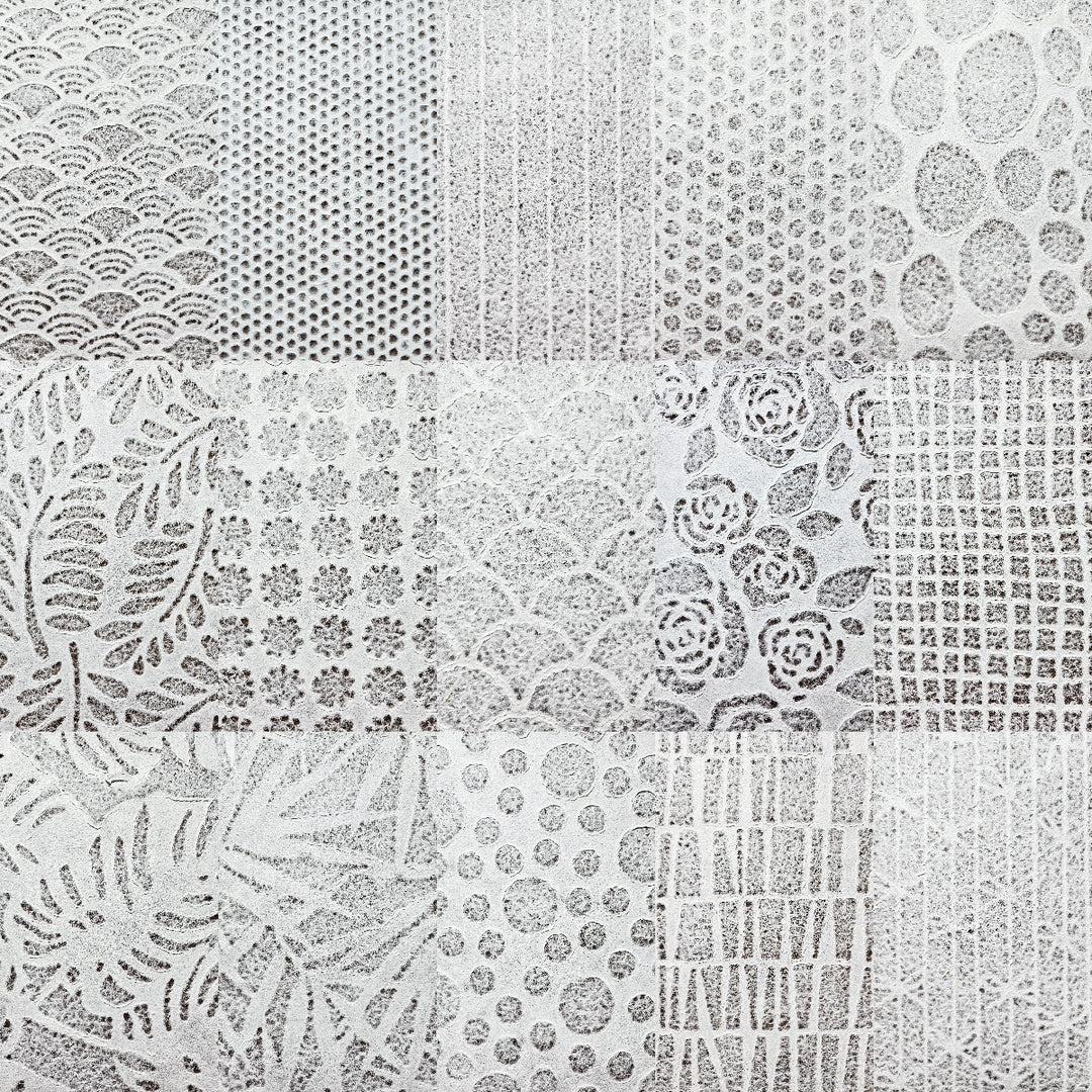 Delicate Rakusui-style handmade paper sheets by Kozo Studio, crafted from mulberry pulp with lace-like patterns for creative projects.