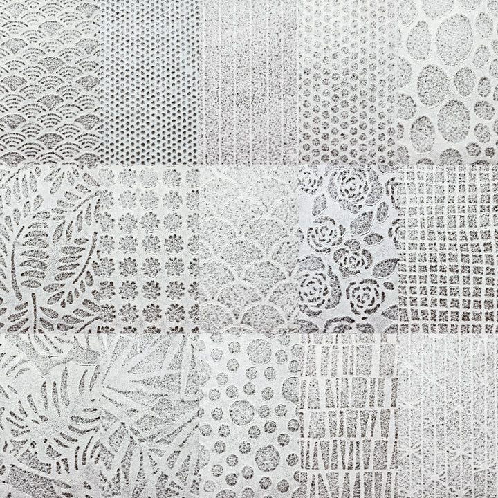Delicate Rakusui-style handmade paper sheets by Kozo Studio, crafted from mulberry pulp with lace-like patterns for creative projects.