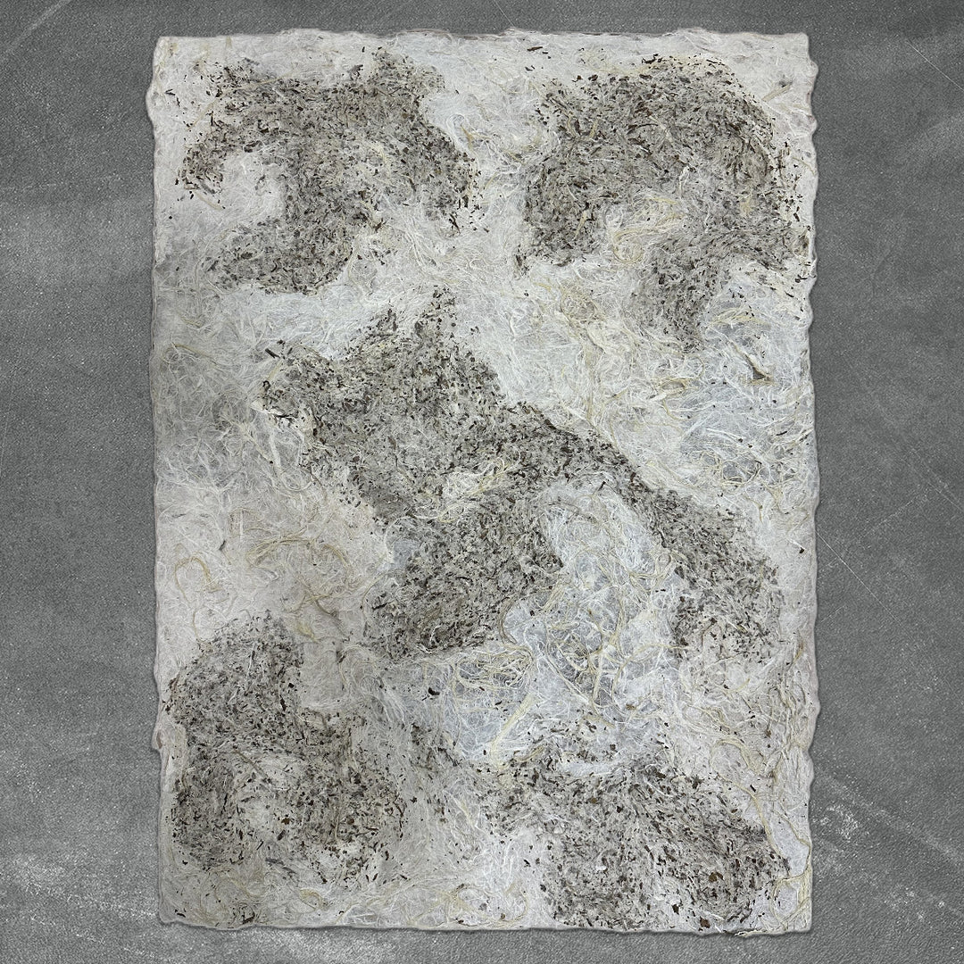 Unique Kozo Studio handmade paper made from mulberry fibers, featuring a rough texture and organic color blend for creative decor and art applications.