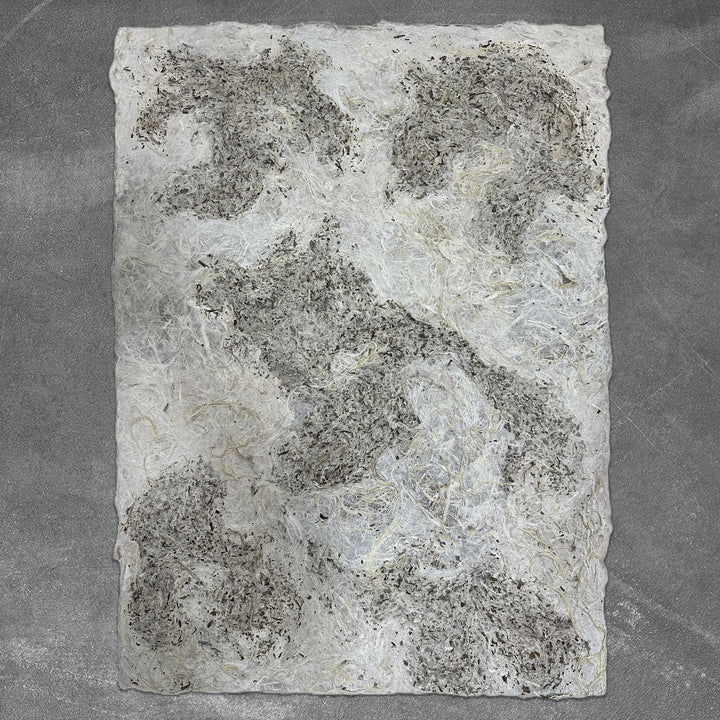 Unique Kozo Studio handmade paper made from mulberry fibers, featuring a rough texture and organic color blend for creative decor and art applications.