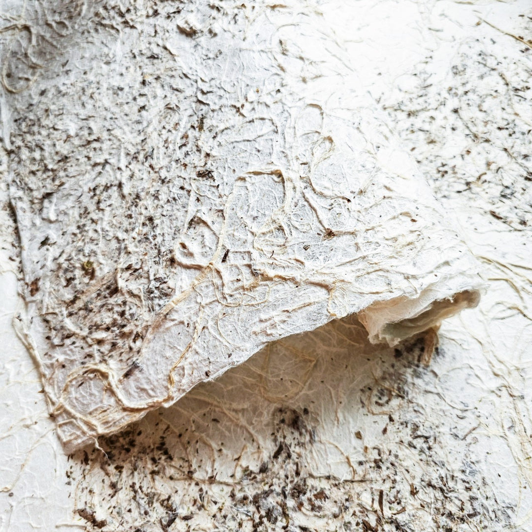 Medium-weight handmade mulberry paper with a bold, rough finish and natural tones, crafted by Kozo Studio for lampshades, collages, and crafts.