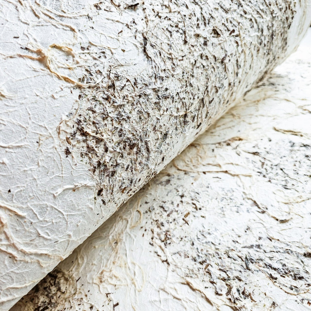 Kozo Studio artisanal mulberry paper with textured surface and two-tone earth hues, perfect for handmade art, décor, and paper crafts.