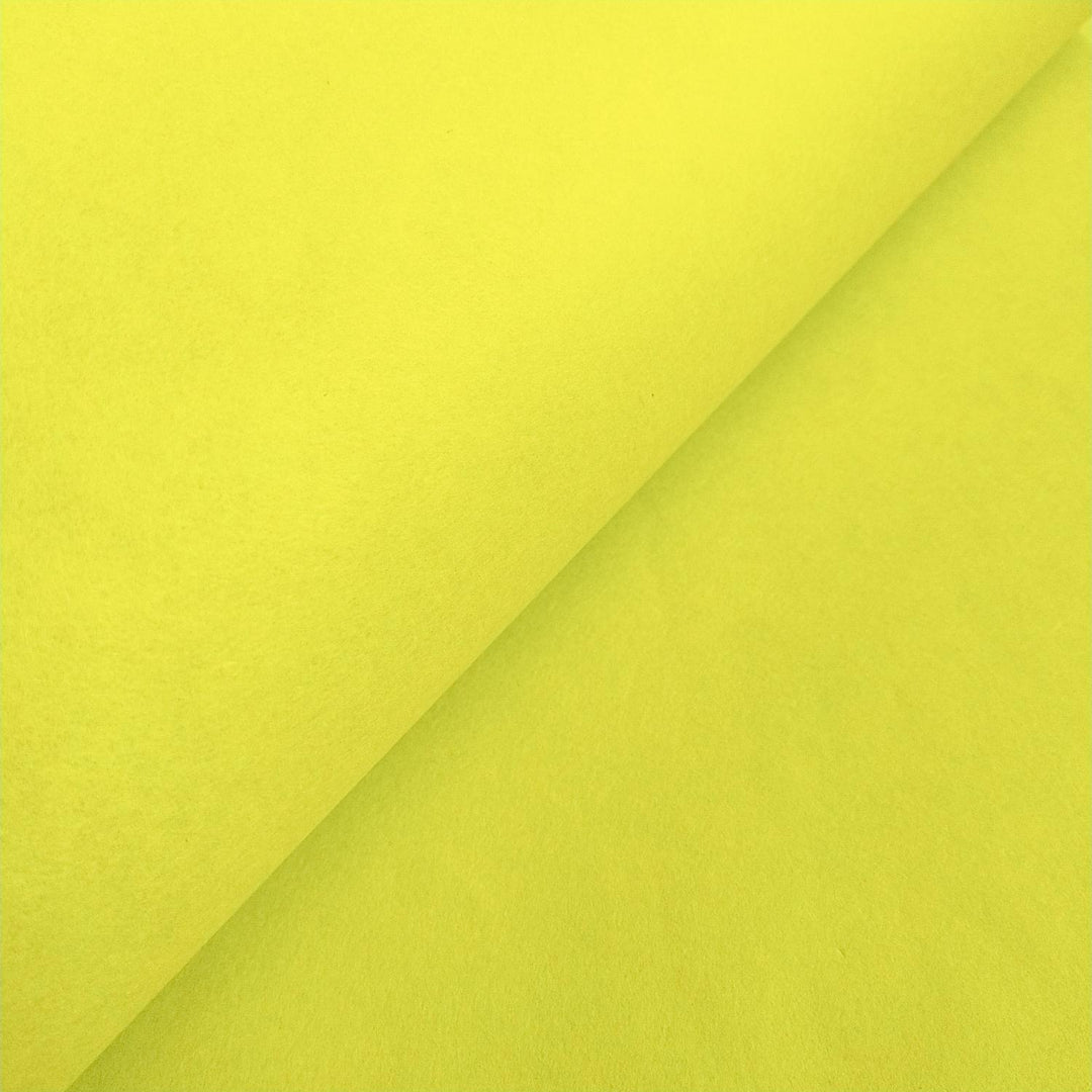 Macro shot of Kozo Studio mulberry paper in Limeade green, featuring gentle highlights that reveal the natural quality of handmade paper.
