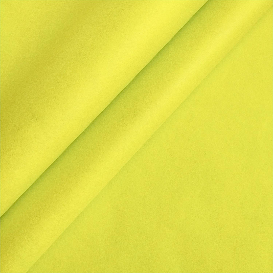 Close-up of Limeade solid-colored mulberry paper folded diagonally, showcasing the soft texture and craftsmanship from Kozo Studio.