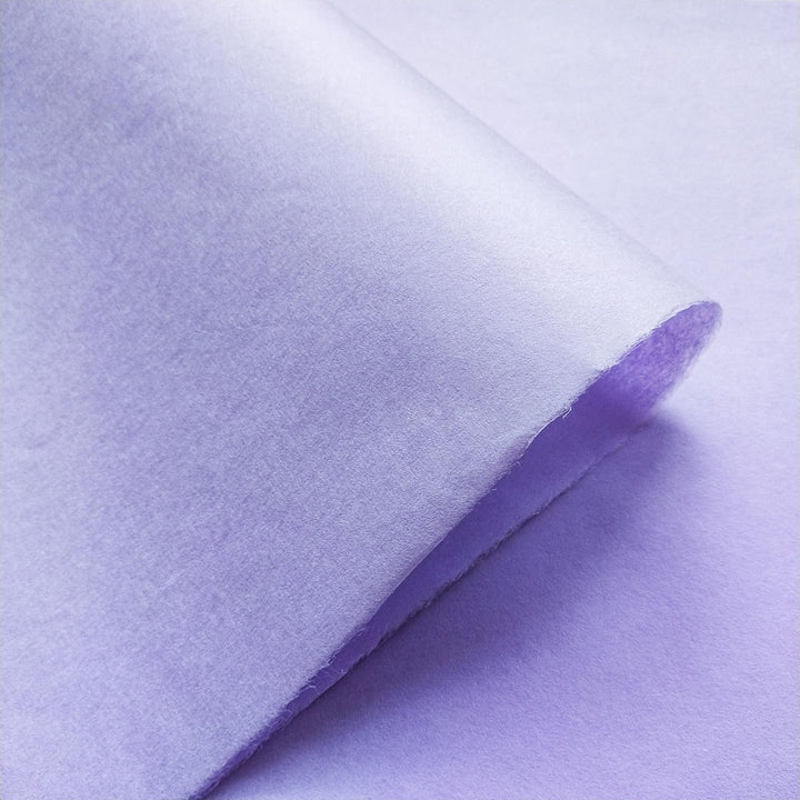 Kozo Studio heather purple handmade paper captured up close, emphasizing the natural texture and mulberry paper quality.