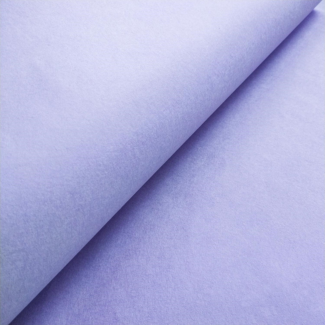 Close-up of Kozo Studio handmade paper in heather purple, featuring smooth texture and rich mulberry paper quality.