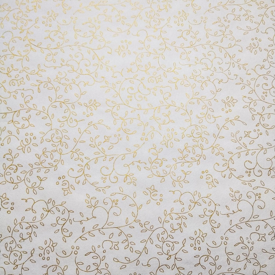 Delicate gold floral pattern printed on fine white mulberry paper by Kozo Studio, showcasing the beauty of handmade paper in a graceful rolled-out display.
