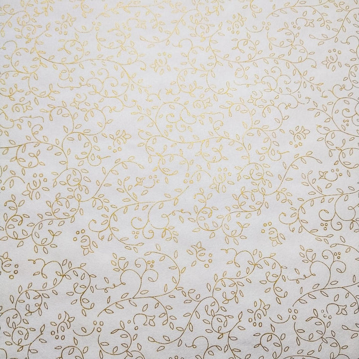 Delicate gold floral pattern printed on fine white mulberry paper by Kozo Studio, showcasing the beauty of handmade paper in a graceful rolled-out display.