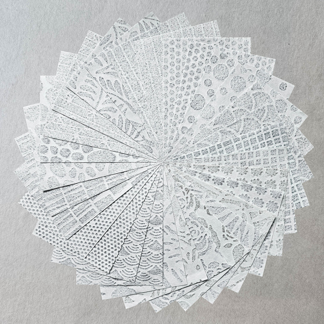 30-sheet pack of handmade mulberry paper from Kozo Studio showcasing acid-free, non-yellowing Rakusui designs perfect for paper crafting.