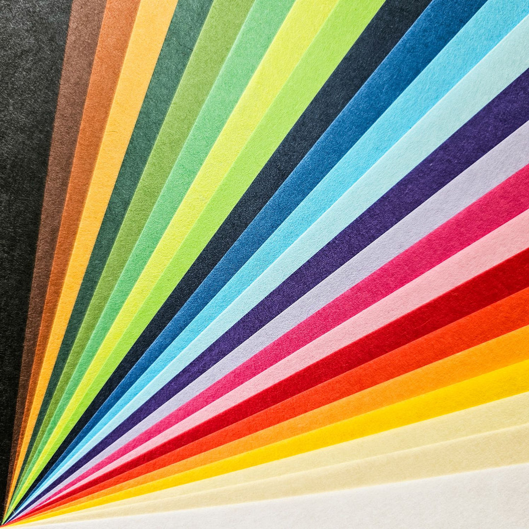 Vibrant selection of lightweight handmade paper by Kozo Studio, featuring smooth-textured mulberry paper sheets that remain durable and bright, ideal for both beginner and advanced paper artists.