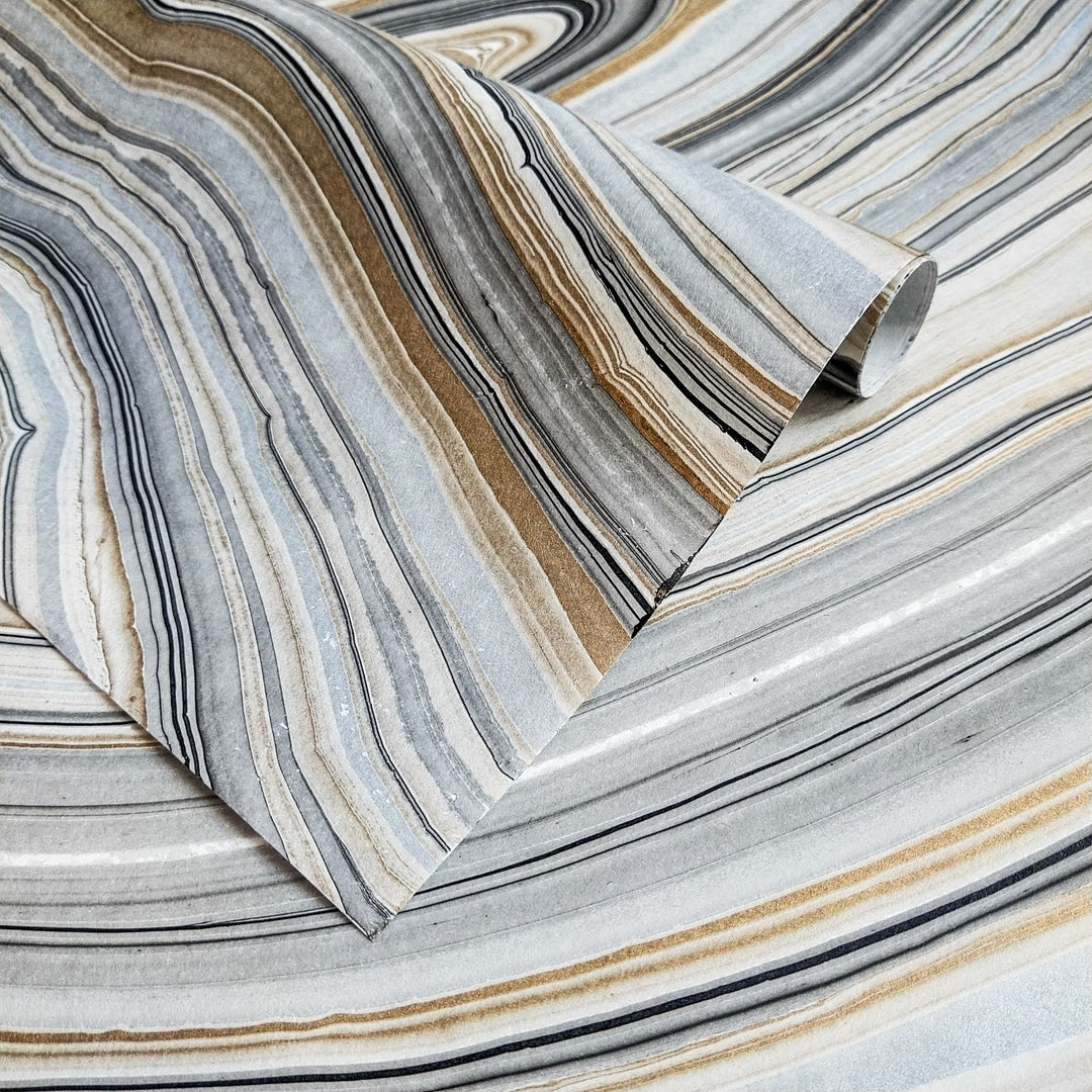 Close-up of Kozo Studio Marble Kozo Paper Design 1 featuring striped handmade paper with stone-like gray, white, and brown patterns, made from high-quality mulberry paper.