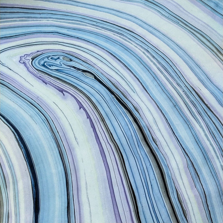 Marble Kozo handmade paper close-up by Kozo Studio showcasing floating oil color technique on mulberry paper for unique artistic effects.