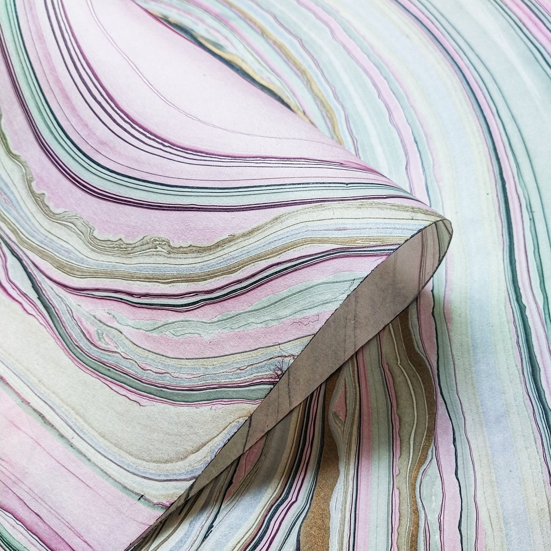 Artistic detail of Marble Kozo Paper Design 5 by Kozo Studio, a handmade paper with intricate swirls of oil-based colors on mulberry paper, perfect for crafts and decor.