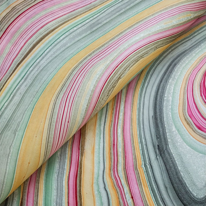 Swirling pastel design on Kozo Studio's handmade Marble Kozo Paper, showcasing the texture and beauty of high-quality mulberry paper.