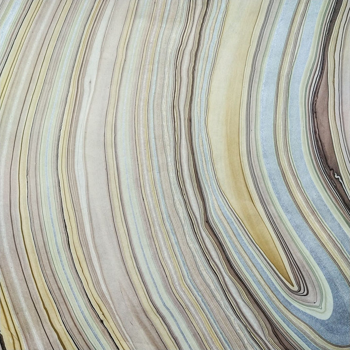 Marble Kozo handmade paper from Kozo Studio, featuring unique swirling colors on mulberry base, ideal for decorative and creative uses.
