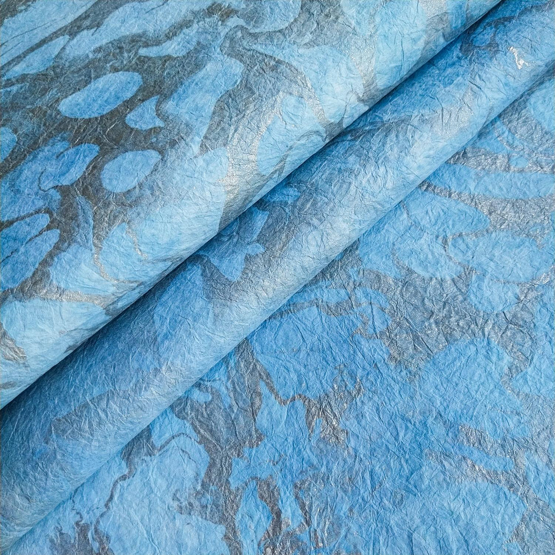Handmade mulberry paper from Kozo Studio featuring graceful marbled patterns and soft, fabric-like textures perfect for artistic and decorative projects.