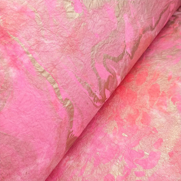 Close-up of Milano Kozo Paper - Design 4 from Kozo Studio, showcasing textured, crumpled mulberry paper with a marbled pink and beige pattern featuring flowing, wavy lines in soft pink hues and subtle beige for a vibrant artistic touch.