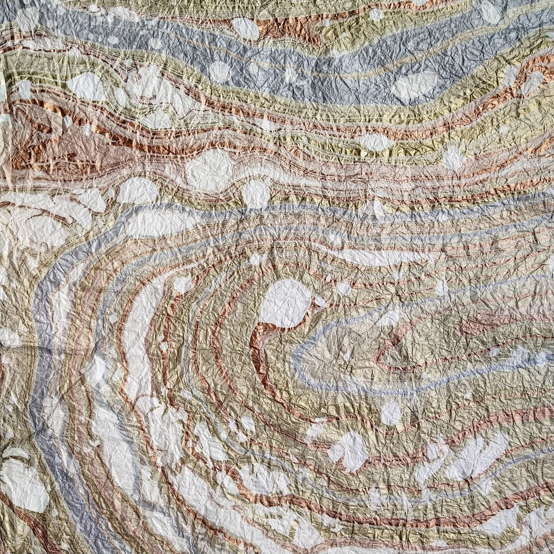 Marbled white mulberry paper crafted by Kozo Studio, displaying the handmade beauty of Milano Kozo Paper – Design 10 with its unique swirling textures and fine quality.