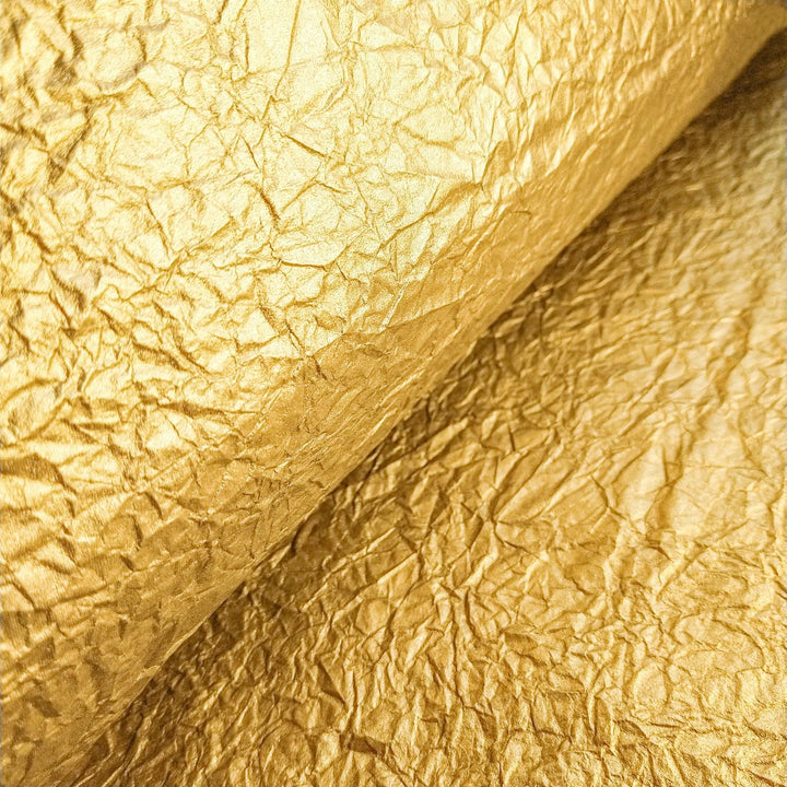 Kozo Studio's gleaming Momigami mulberry paper in gold, offering a flexible handmade paper with a unique fabric-like texture.