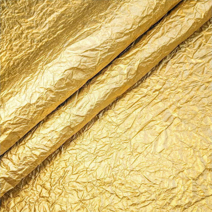 Handmade gold metallic mulberry paper with crinkled surface, ideal for craft projects and available at Kozo Studio.