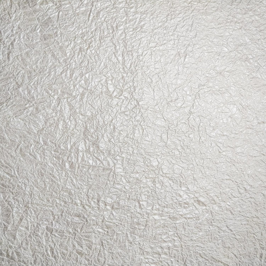 Handmade mulberry paper from Kozo Studio with a crumpled texture and metallic shimmer, ideal for unique art and craft projects.