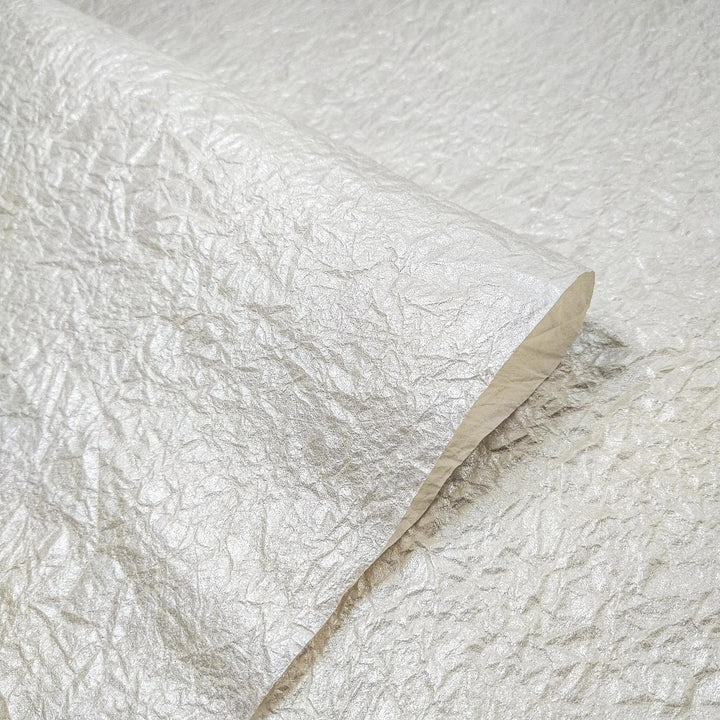 Pearl-colored Momigami Kozo Paper by Kozo Studio, a flexible handmade paper with a fabric-like texture and dual finish.