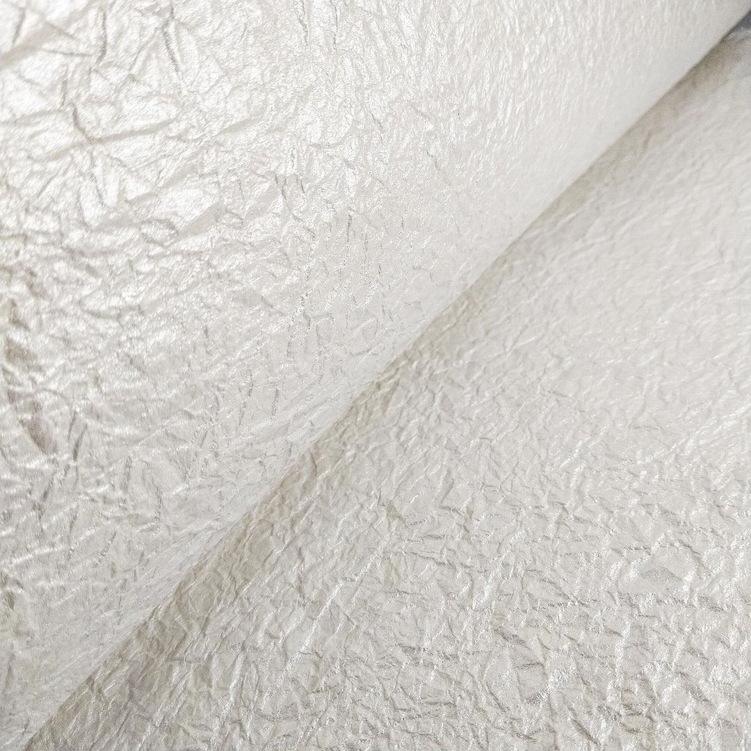 Metallic mulberry paper with a crumpled surface from Kozo Studio, offering a glossy side and matte side for creative versatility.