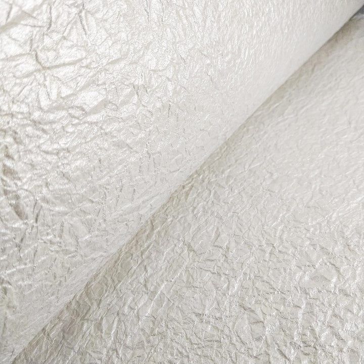 Metallic mulberry paper with a crumpled surface from Kozo Studio, offering a glossy side and matte side for creative versatility.