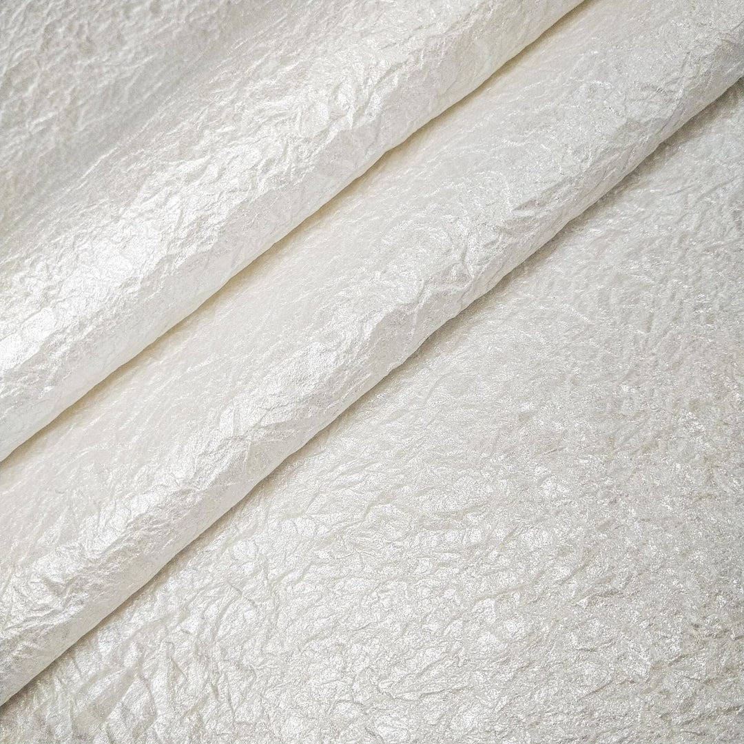High-flexibility handmade paper from Kozo Studio featuring gleaming metallic shine and a tactile, fabric-like mulberry texture.