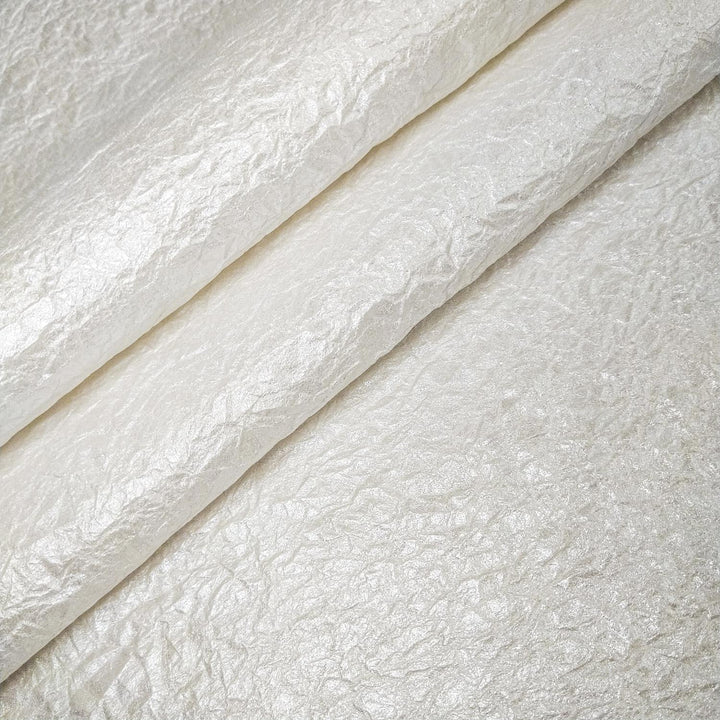 High-flexibility handmade paper from Kozo Studio featuring gleaming metallic shine and a tactile, fabric-like mulberry texture.