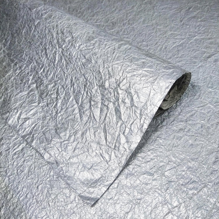 Shiny silver Momigami Gleaming Metallic mulberry paper with a matte back, crafted by Kozo Studio as premium handmade paper.
