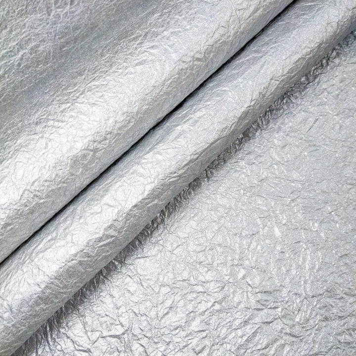 Handmade metallic mulberry paper with a unique crumpled design from Kozo Studio, perfect for craft and art projects.