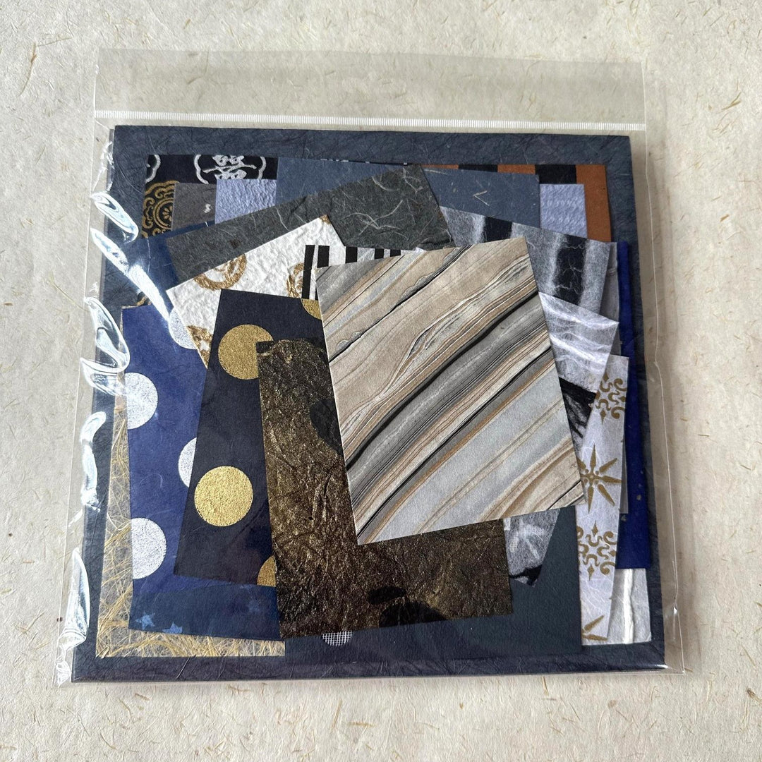Hand-selected handmade paper scraps by Kozo Studio, with a 100-piece mulberry paper pack in calming shades of blue, white, and gold. Perfect for creative DIY projects and art journaling.