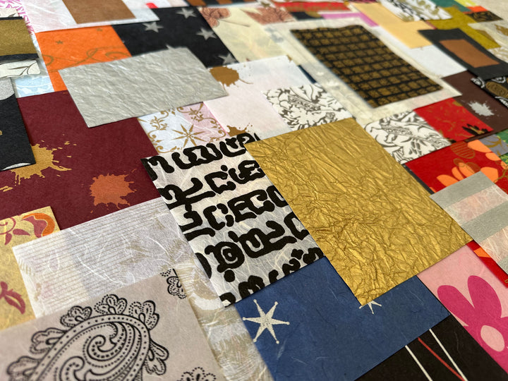 A vibrant and dynamic collage features Kozo Studios Mulberry Paper Scrap Pack (100 Pieces) - Print Carnival, showcasing textured rice and mulberry papers with floral designs, abstract prints, metallic gold accents, and scripted text in a colorful assortment.