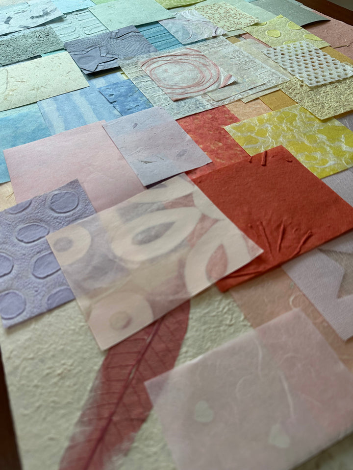 A vibrant mix of handmade paper scraps by Kozo Studio, this 100-piece pastel mulberry paper pack offers diverse textures and patterns for creative expression.