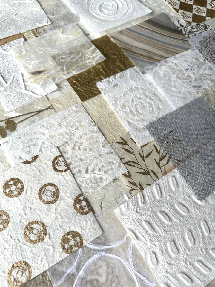 The Mulberry Paper Scrap Pack (100 Pieces) - Golden Harvest by Kozo Studio features textured squares of mulberry and rice paper in white, cream, and gold hues with swirls, stripes, and floral prints that form a stunning patchwork effect.