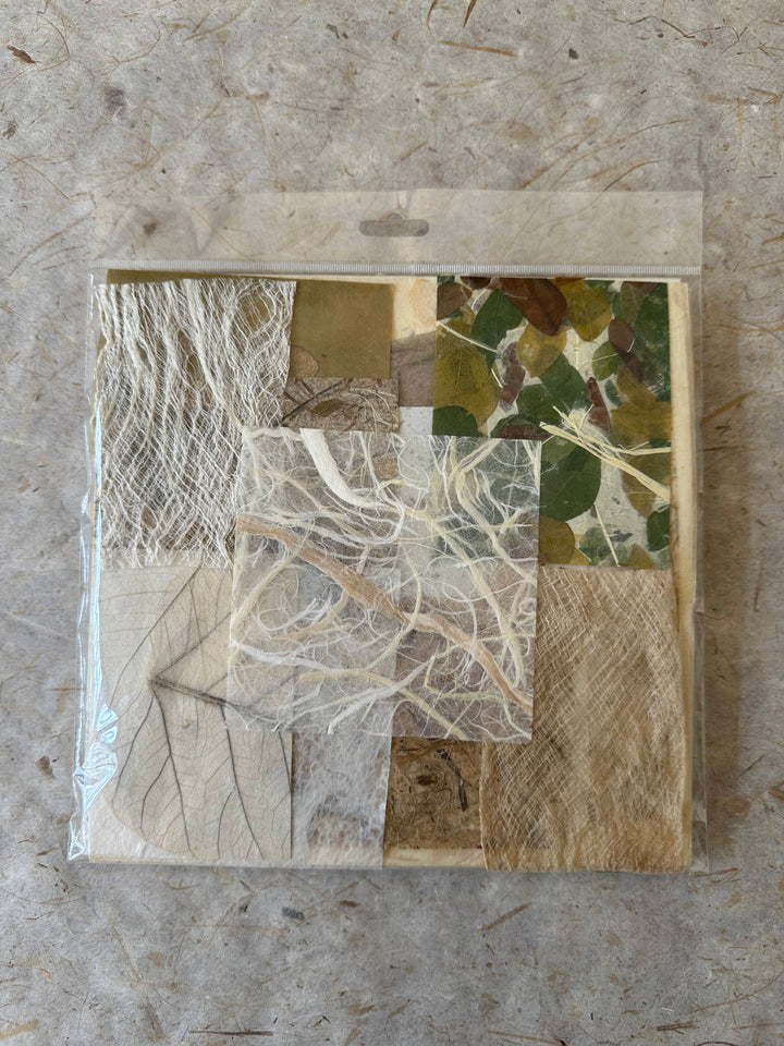 Mulberry paper assortment from Kozo Studio featuring beige, brown, green, and white handmade paper with natural textures.