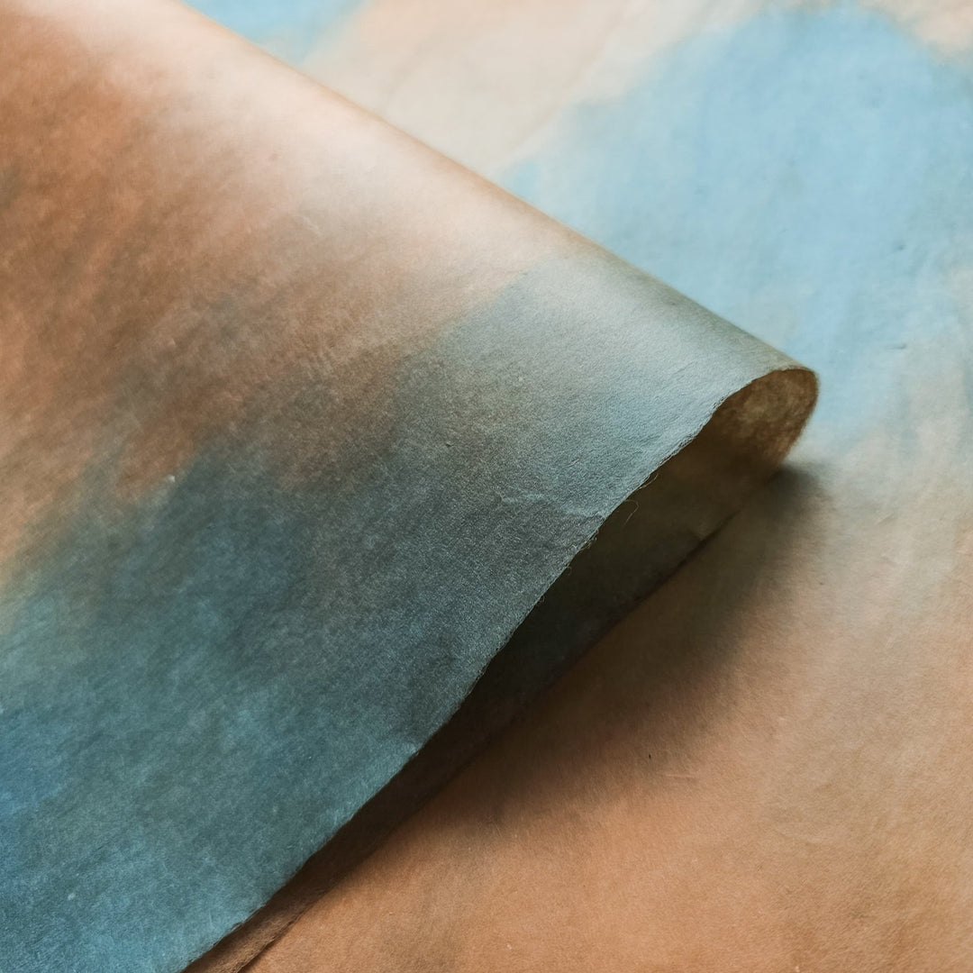 Elegant handmade mulberry paper by Kozo Studio in a woodland overcast colorway, featuring a soft ombre blend and natural surface texture.